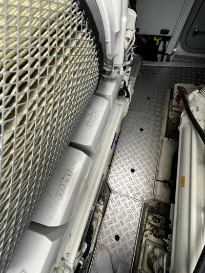  Yacht Photos Pics Engine room of a 2011 Princess V62 yacht, featuring metallic components and grid design.