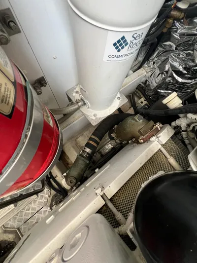  Yacht Photos Pics Engine room of a 2011 Princess V62 yacht with visible fire extinguisher and piping.