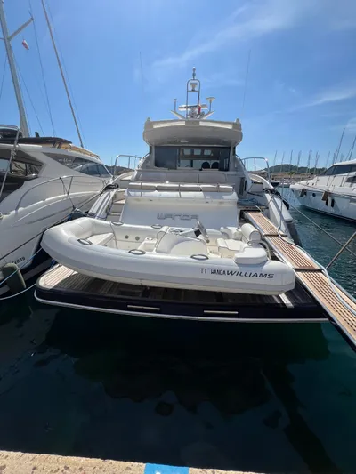  Yacht Photos Pics Luxury 2011 Princess V62 yacht docked with inflatable boat on deck.