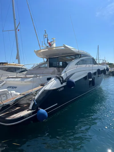  Yacht Photos Pics Luxurious 2011 Princess V62 yacht docked in a sunny marina.