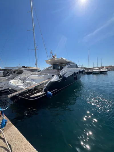  Yacht Photos Pics Luxurious 2011 Princess V62 yacht docked in a sunny marina.