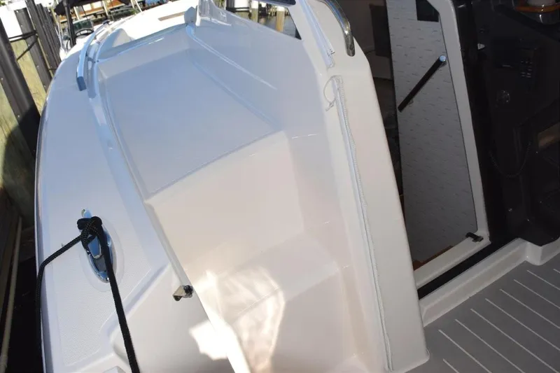 Diamond Pearl Yacht Photos Pics 2024 Tiara Yachts 38 LS, portside boarding steps make fixed dock access easy. Cabin entry door to left of helm.