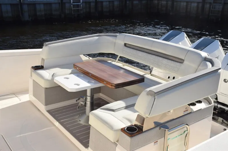 Diamond Pearl Yacht Photos Pics 2024 Tiara Yachts 38 LS luxury seating area with elegant table and comfortable cushions.