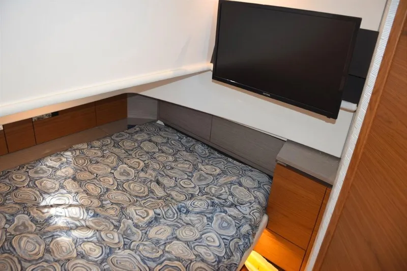 Diamond Pearl Yacht Photos Pics Air-conditioned cabin with full berth and wall-mounted TV.