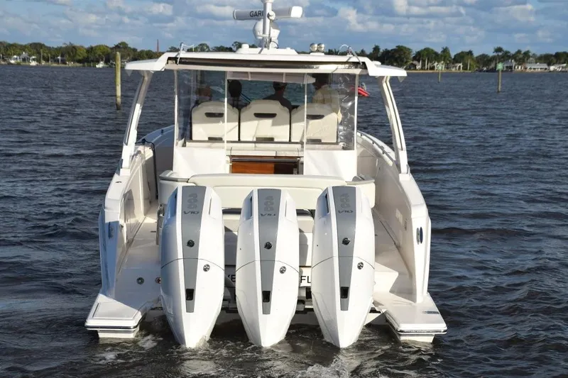 Diamond Pearl Yacht Photos Pics Extended platforms outboard of motors - nice access. Indicator lights aft are on when engines are running. Swim ladder folds out on portside.
