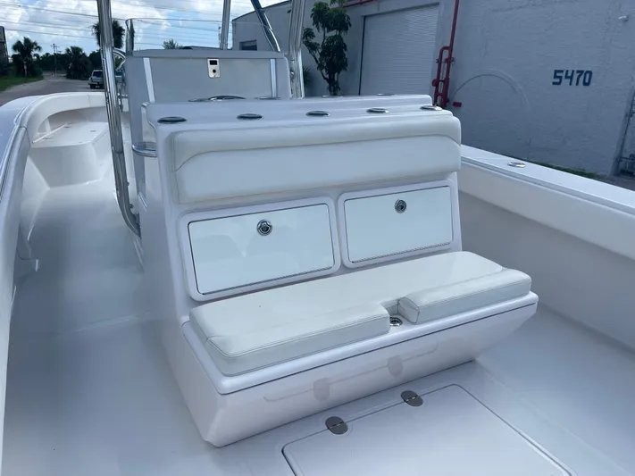  Yacht Photos Pics 2013 Bahama Open Fisherman boat interior with white seating and storage compartments.