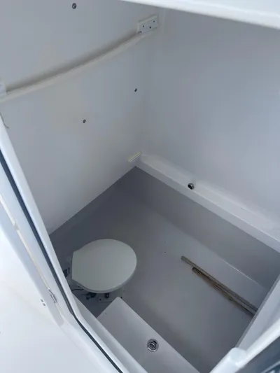  Yacht Photos Pics 2013 Bahama Open Fisherman boat interior with toilet and storage space