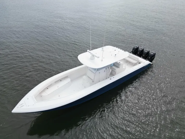  Yacht Photos Pics 2013 Bahama Open Fisherman boat with four outboard motors on water.