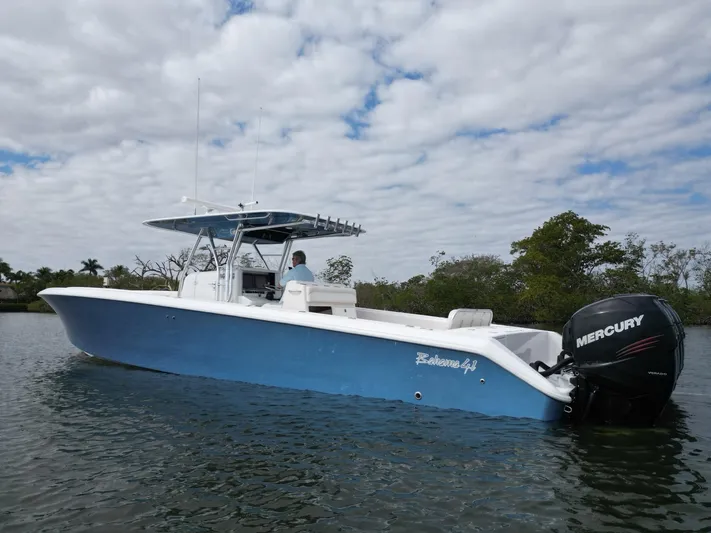  Yacht Photos Pics 2013 Bahama Open Fisherman boat with Mercury engine on calm water.