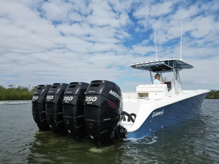  Yacht Photos Pics 2013 Bahama Open Fisherman boat with four Mercury 350 Verado engines on water.