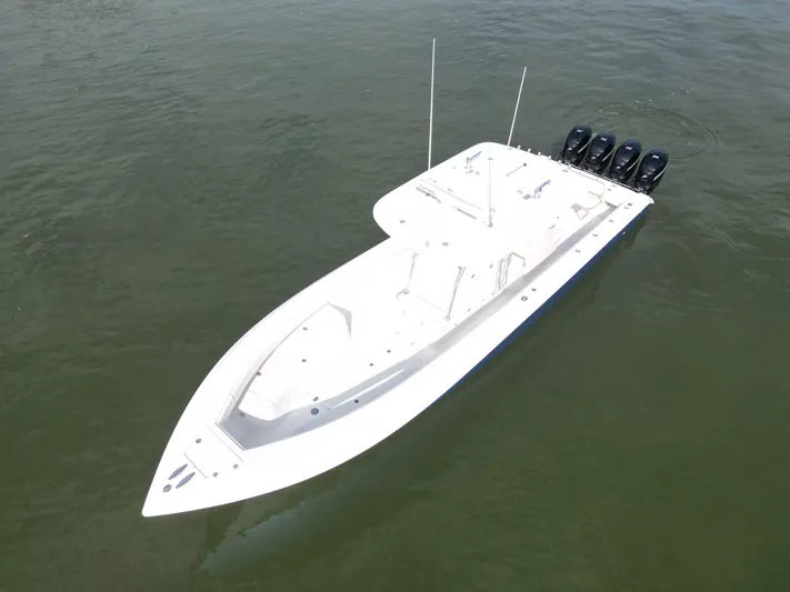  Yacht Photos Pics 2013 Bahama Open Fisherman boat with four outboard motors on water.