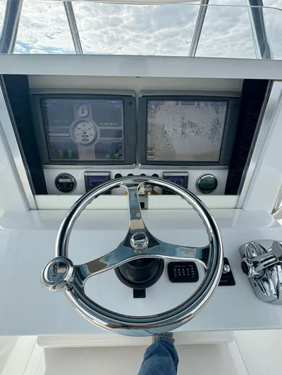  Yacht Photos Pics 2013 Bahama Open Fisherman helm with dual Garmin displays and stainless steel steering wheel.