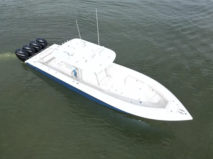  Yacht Photos Pics 2013 Bahama Open Fisherman boat with four Mercury outboard engines on water.