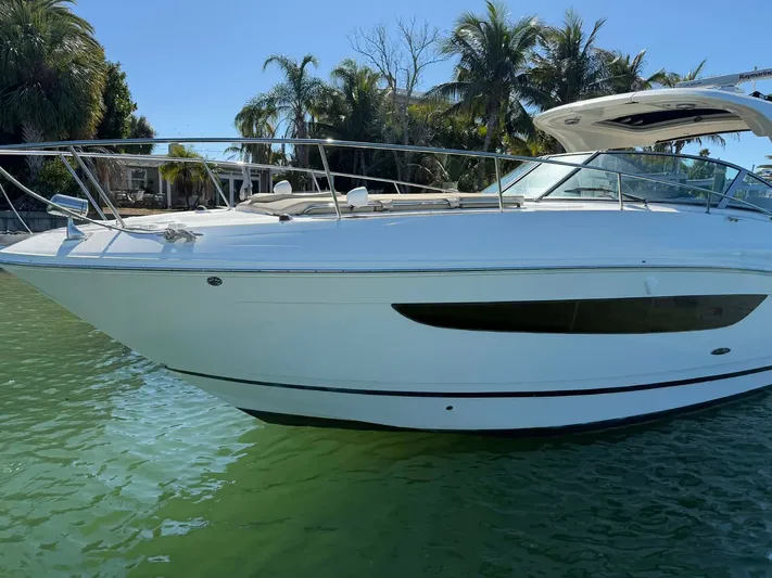 I'll Have Another Yacht Photos Pics 2016 Sea Ray Sundancer 350 on calm water with palm trees in background.