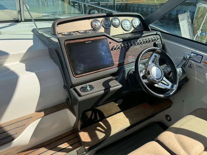 I'll Have Another Yacht Photos Pics 2016 Sea Ray Sundancer 350 cockpit with steering wheel and instruments.