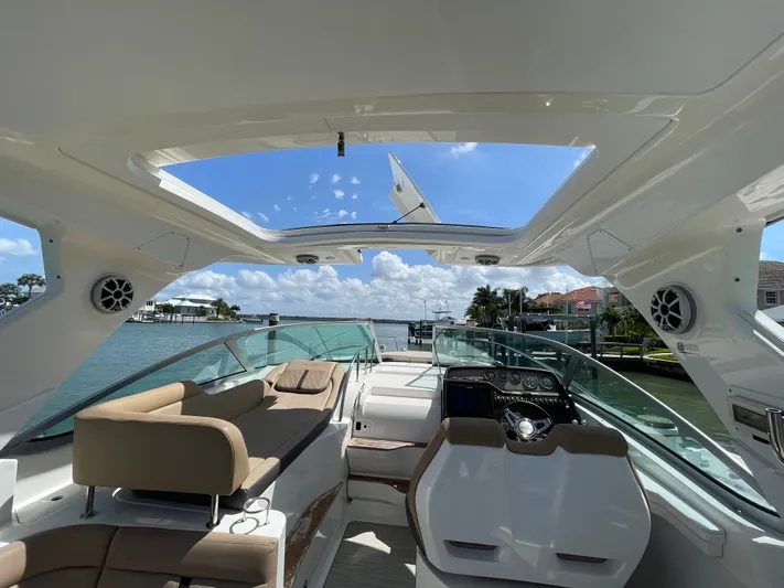 I'll Have Another Yacht Photos Pics Interior of a 2016 Sea Ray Sundancer 350 yacht with open roof.