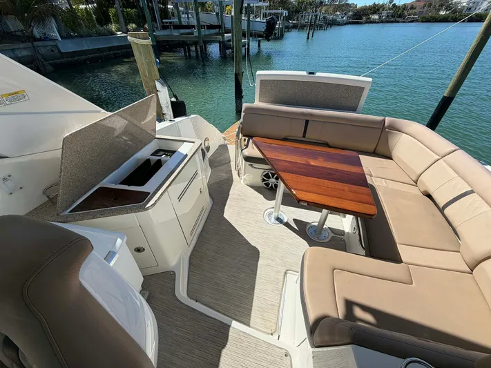 I'll Have Another Yacht Photos Pics Interior of a 2016 Sea Ray Sundancer 350 yacht with seating area.