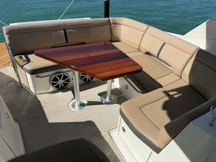 I'll Have Another Yacht Photos Pics Interior of 2016 Sea Ray Sundancer 350 yacht with beige seating area.