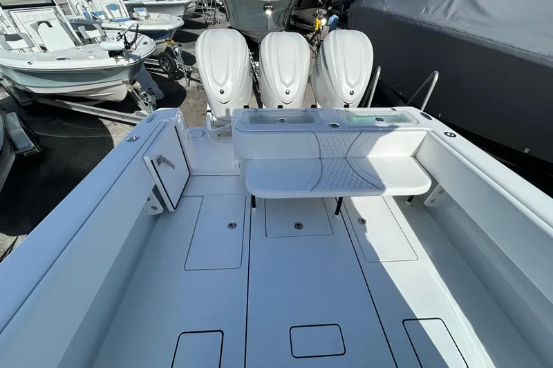  Yacht Photos Pics 2026 Contender 35 ST boat interior with triple outboard engines, spacious deck, and seating area.