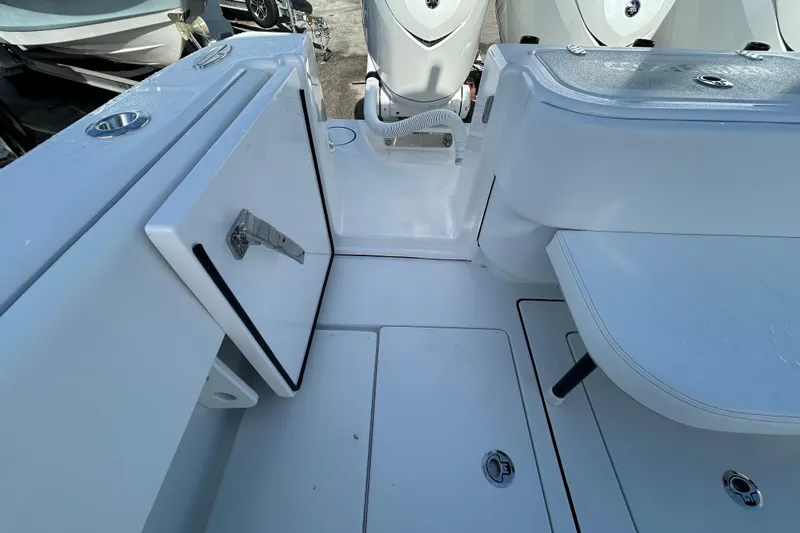  Yacht Photos Pics 2026 Contender 35 ST boat interior with storage compartments and seating area.