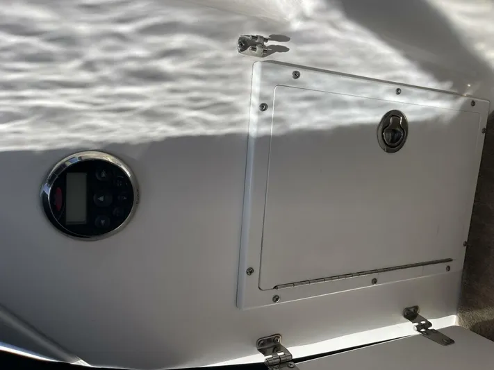  Yacht Photos Pics Control panel and storage compartment on a 2007 Rinker 350 Express Cruiser boat.