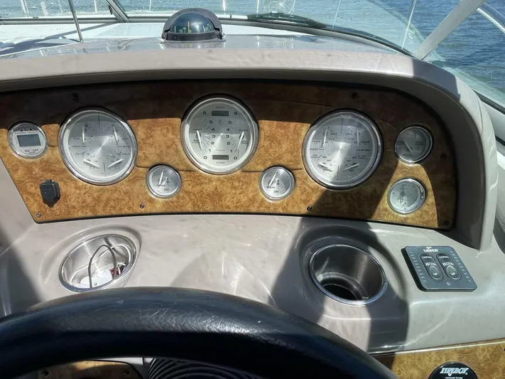  Yacht Photos Pics Dashboard of a 2007 Rinker 350 Express Cruiser with gauges and controls.