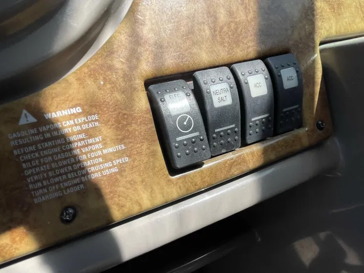  Yacht Photos Pics Control panel of a 2007 Rinker 350 Express Cruiser with warning label and switches.