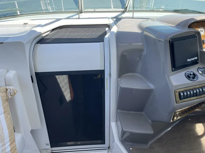  Yacht Photos Pics 2007 Rinker 350 Express Cruiser helm with navigation controls and cabin entry.