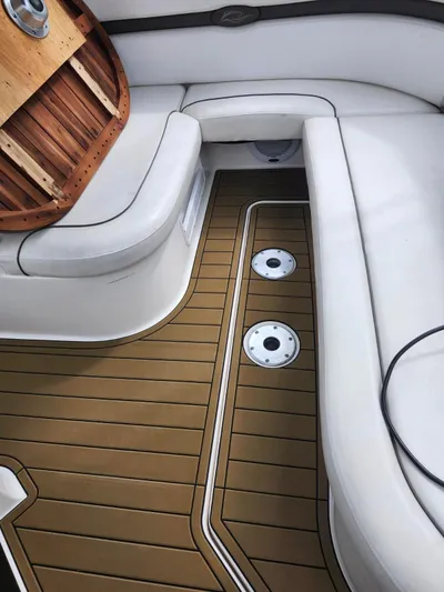  Yacht Photos Pics 2007 Rinker 350 Express Cruiser interior with white seating and wood-style flooring.