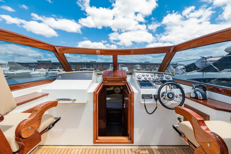  Yacht Photos Pics Vento V40 Retro Classic Open 2023 boat interior with wooden accents and modern controls.