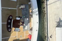 Overhead view of a 1999 Viking 58 EB boat docked at a marina.