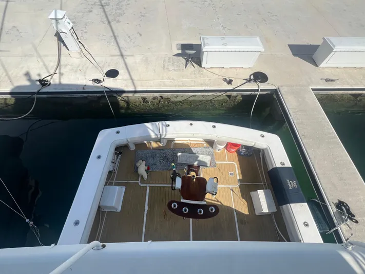  Yacht Photos Pics 1999 Viking 58 EB yacht docked, aerial view of deck and seating area.