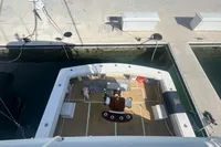 1999 Viking 58 EB yacht docked, aerial view of deck and seating area.