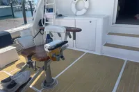 1999 Viking 58 EB yacht deck with fishing chair and life preserver.
