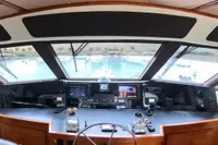 Cockpit of a 1999 Viking 58 yacht with navigation equipment and panoramic view.