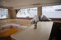 Luxurious interior of a 1999 Viking 58 yacht with elegant seating and decor.
