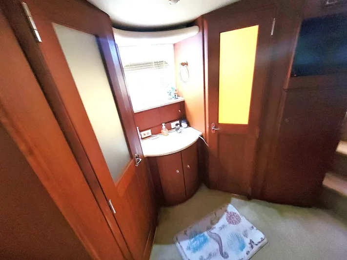 All Inn Yacht Photos Pics Interior of 2005 Silverton 43 Motor Yacht with wooden cabinetry and a small sink area.