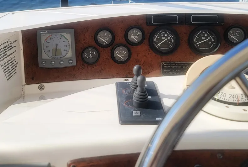 All Inn Yacht Photos Pics Control panel of a 2005 Silverton 43 Motor Yacht with gauges and navigation equipment.