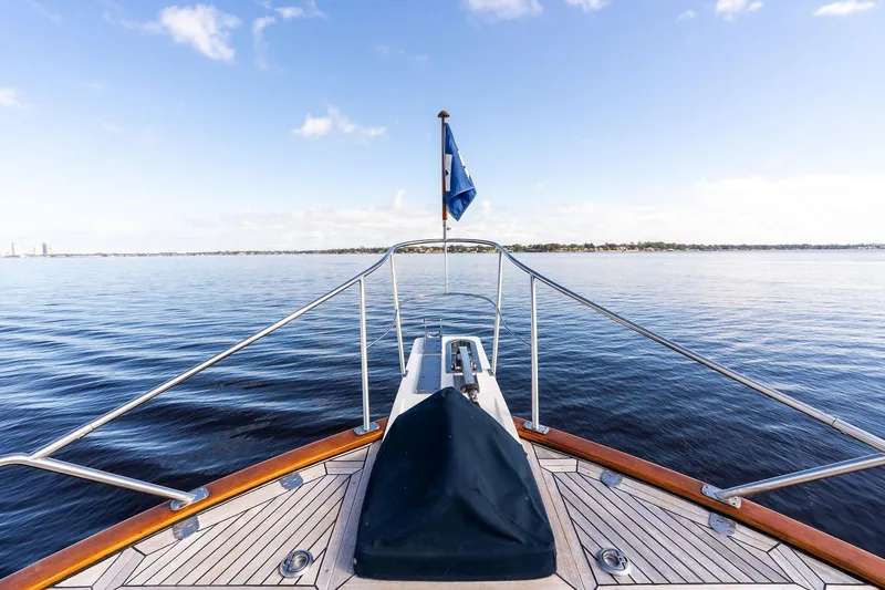 Draagen Yacht Photos Pics Bow view of 2006 Grand Banks Europa 47 yacht on calm water.