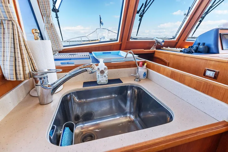 Draagen Yacht Photos Pics Galley sink area on 2006 Grand Banks Europa 47 yacht with ocean view.