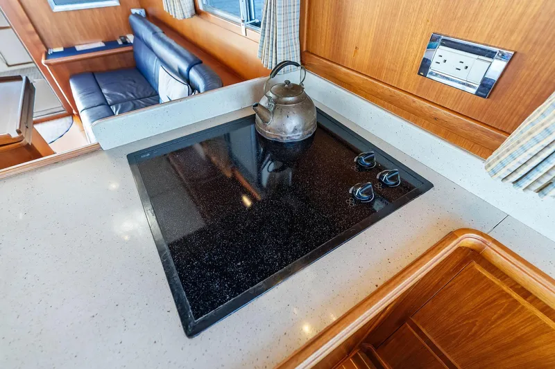 Draagen Yacht Photos Pics 2006 Grand Banks Europa 47 yacht kitchen with stovetop and kettle.