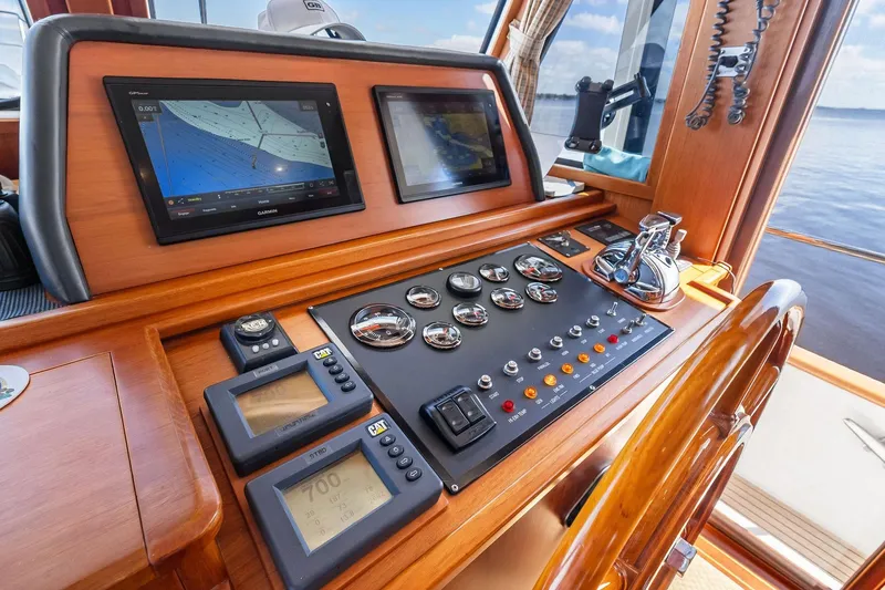 Draagen Yacht Photos Pics Helm of 2006 Grand Banks Europa 47 yacht with navigation screens and controls.