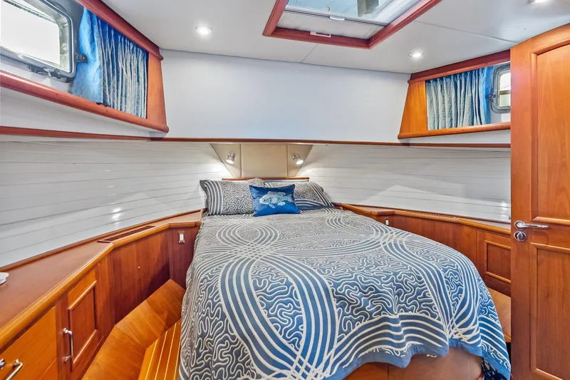 Draagen Yacht Photos Pics Luxurious cabin interior of 2006 Grand Banks Europa 47 yacht with elegant wood finish.