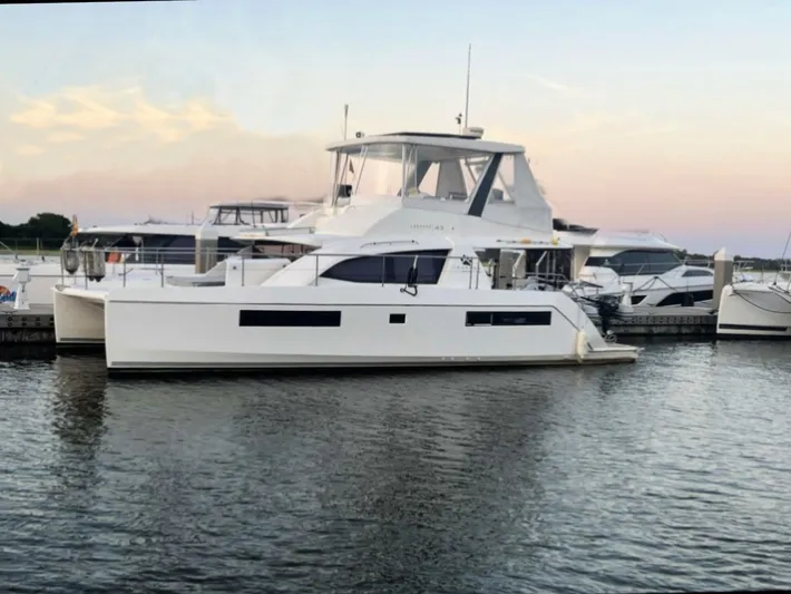 Frida Cat Yacht Photos Pics 2018 Leopard 43 catamaran docked at marina during sunset.