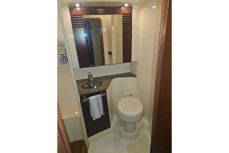 Sea Trials Yacht Photos Pics Luxurious bathroom in 2007 Sea Ray 44 Sedan Bridge yacht, featuring modern fixtures and elegant design.