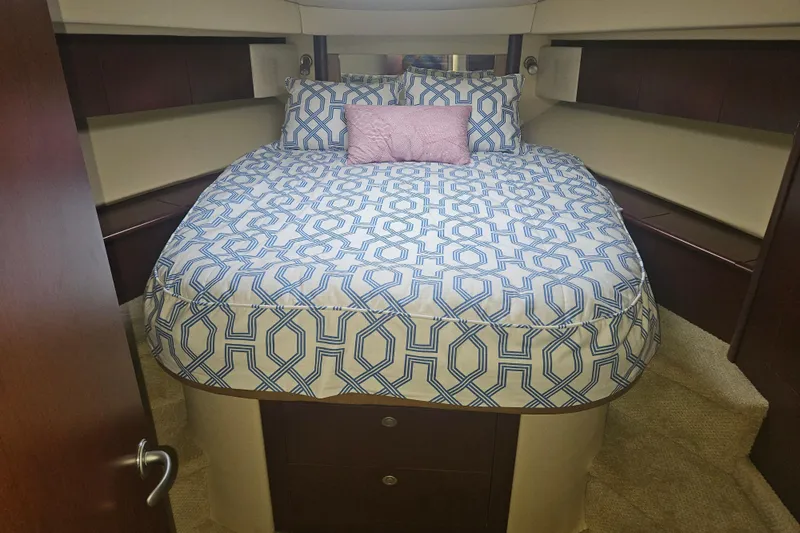 Sea Trials Yacht Photos Pics Luxurious bedroom interior of 2007 Sea Ray 44 Sedan Bridge yacht with patterned bedding.
