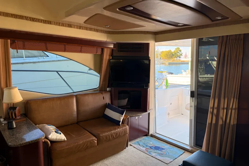 Sea Trials Yacht Photos Pics Interior of 2007 Sea Ray 44 Sedan Bridge yacht with leather seating and waterfront view.