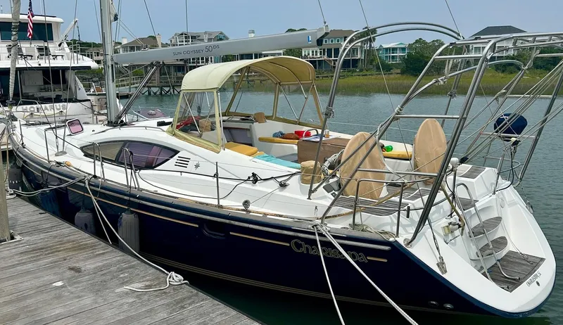 Charisapa Yacht Photos Pics 2012 Jeanneau 50 DS sailboat docked, featuring sleek design and spacious deck.