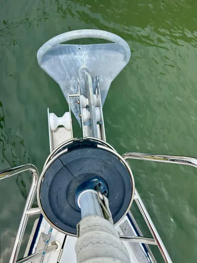 Charisapa Yacht Photos Pics Jeanneau 50 DS 2012 sailboat anchor and bow detail over green water.