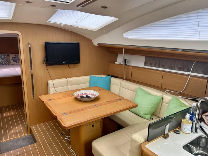 Charisapa Yacht Photos Pics Interior of 2012 Jeanneau 50 DS yacht with cozy seating and modern amenities.